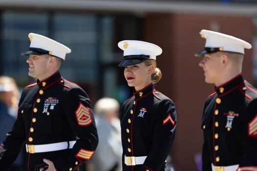 Benton Harbor, Michigan, USA - May 4, 2019: Blossomtime Festival Grand Floral Parade, Members of the United States Marine Corps walking down the street during the parade