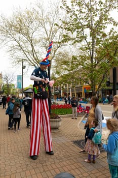 Holland, Michigan, USA - May 11, 2019: Street performer entertaining locals and tourist during the tulip time festival