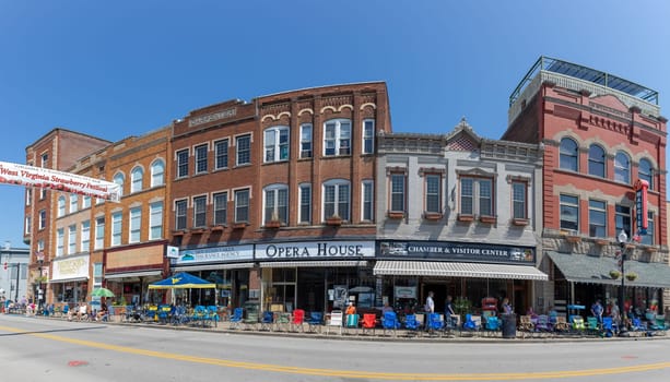 Buckhannon, West Virginia, USA - May 18, 2019: The Historic Building along Main Street, with locals and tourist walking along, waiting for the parade