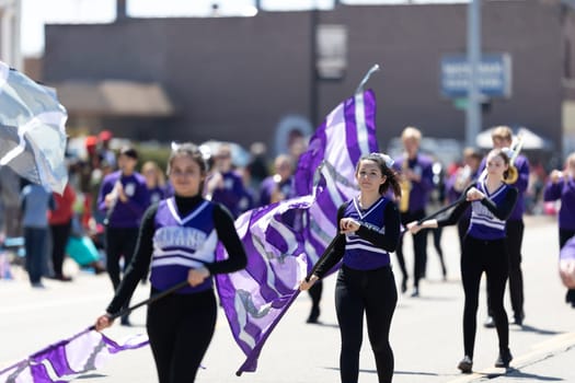 Benton Harbor, Michigan, USA - May 4, 2019: Blossomtime Festival Grand Floral Parade, Members of the Titans Michigan Lutheran Marching band performing at the parade