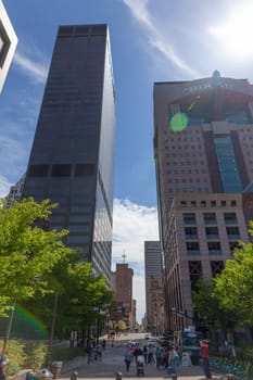 Louisville, Kentucky, USA - April 13, 2019: The Skyline of downtown louisville, looking down South 5th Street, with people walking on the street