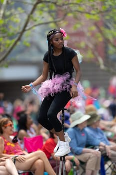Cleveland, Ohio, USA - June 8, 2019: Parade the Circle, young women riding unicycles