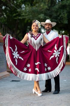 Matamoros, Tamaulipas, Mexico - June 30, 2019:  Kermes Cathedral Nuestra Senora del Refugio, Men and women in traditional clothing, performing traditional dances during a Church Festival in the streets of Matamoros