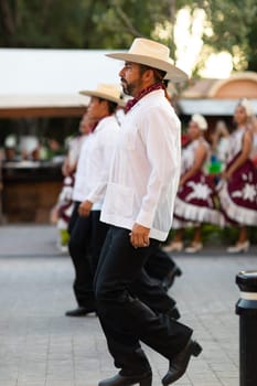 Matamoros, Tamaulipas, Mexico - June 30, 2019:  Kermes Cathedral Nuestra Senora del Refugio, Men and women in traditional clothing, performing traditional dances during a Church Festival in the streets of Matamoros