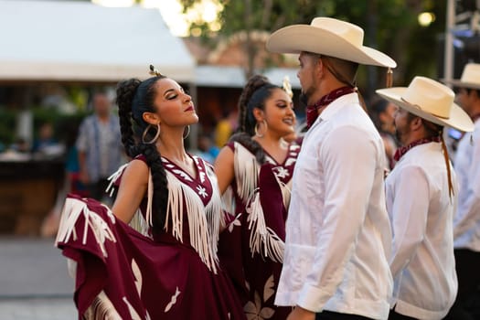 Matamoros, Tamaulipas, Mexico - June 30, 2019:  Kermes Cathedral Nuestra Senora del Refugio, Men and women in traditional clothing, performing traditional dances during a Church Festival in the streets of Matamoros
