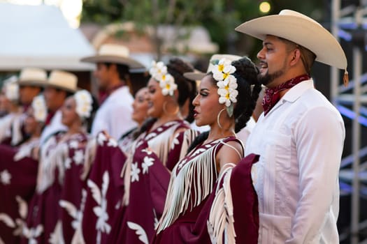 Matamoros, Tamaulipas, Mexico - June 30, 2019:  Kermes Cathedral Nuestra Senora del Refugio, Men and women in traditional clothing, performing traditional dances during a Church Festival in the streets of Matamoros
