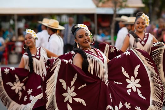Matamoros, Tamaulipas, Mexico - June 30, 2019:  Kermes Cathedral Nuestra Senora del Refugio, Men and women in traditional clothing, performing traditional dances during a Church Festival in the streets of Matamoros