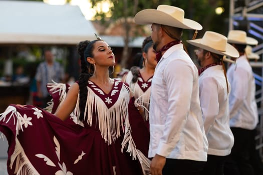 Matamoros, Tamaulipas, Mexico - June 30, 2019:  Kermes Cathedral Nuestra Senora del Refugio, Men and women in traditional clothing, performing traditional dances during a Church Festival in the streets of Matamoros