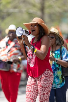 Cleveland, Ohio, USA - June 8, 2019: Parade the Circle, African American woman singing using a loud speaker during the parade