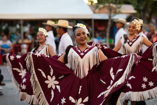 Matamoros, Tamaulipas, Mexico - June 30, 2019:  Kermes Cathedral Nuestra Senora del Refugio, Men and women in traditional clothing, performing traditional dances during a Church Festival in the streets of Matamoros