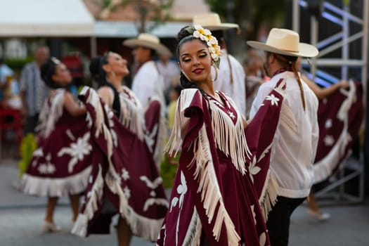 Matamoros, Tamaulipas, Mexico - June 30, 2019:  Kermes Cathedral Nuestra Senora del Refugio, Men and women in traditional clothing, performing traditional dances during a Church Festival in the streets of Matamoros