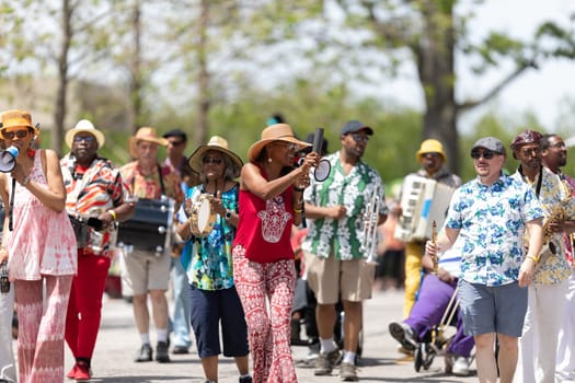 Cleveland, Ohio, USA - June 8, 2019: Parade the Circle, African American woman singing using a loud speaker during the parade