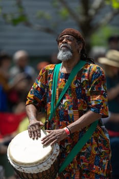 Cleveland, Ohio, USA - June 8, 2019: Parade the Circle, African American man playing the drums during the parade