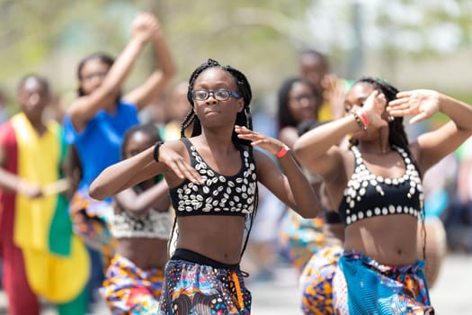 Cleveland, Ohio, USA - June 8, 2019: Parade the Circle, african american women and children wearing african style clothing dancing