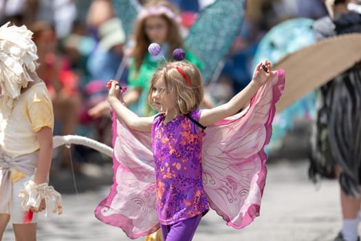 Cleveland, Ohio, USA - June 8, 2019: Parade the Circle, girl dress up as a butterfly