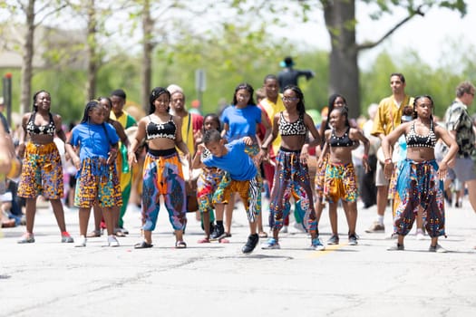 Cleveland, Ohio, USA - June 8, 2019: Parade the Circle, african american women and children wearing african style clothing dancing