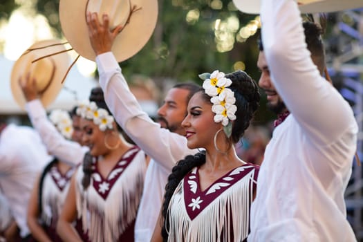 Matamoros, Tamaulipas, Mexico - June 30, 2019:  Kermes Cathedral Nuestra Senora del Refugio, Men and women in traditional clothing, performing traditional dances during a Church Festival in the streets of Matamoros