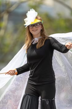 Cleveland, Ohio, USA - June 8, 2019: Parade the Circle, young woman on stilts using an outfit with wings
