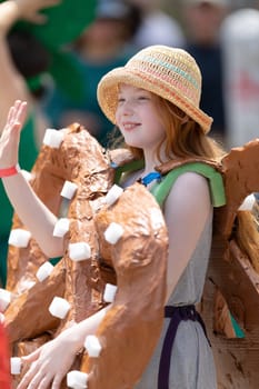 Cleveland, Ohio, USA - June 8, 2019: Parade the Circle, young redhead dress up as a pretzel