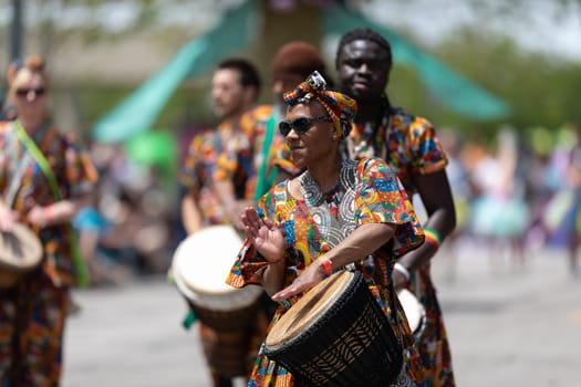 Cleveland, Ohio, USA - June 8, 2019: Parade the Circle, African American woman playing the drums during the parade