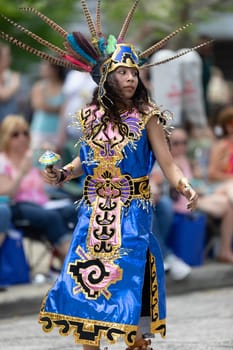 Cleveland, Ohio, USA - June 8, 2019: Parade the Circle, woman and children using aztek outfits dancing.