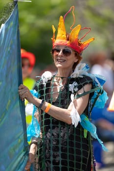 Cleveland, Ohio, USA - June 8, 2019: Parade the Circle, woman wearing an abstract outfit during the parade