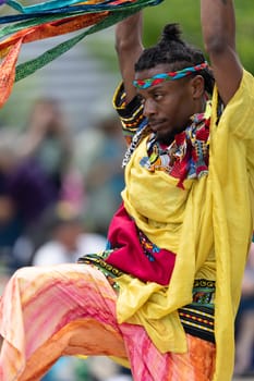 Cleveland, Ohio, USA - June 8, 2019: Parade the Circle, African American man dancing with ribbons during the parade