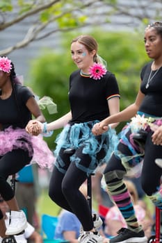 Cleveland, Ohio, USA - June 8, 2019: Parade the Circle, young women riding unicycles