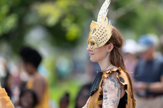 Cleveland, Ohio, USA - June 8, 2019: Parade the Circle, caucasian woman wearing an african style outfit during the parade