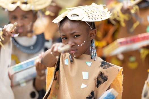 Cleveland, Ohio, USA - June 8, 2019: Parade the Circle, children wearing african style clothing playing the drums