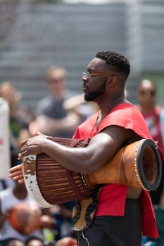 Cleveland, Ohio, USA - June 8, 2019: Parade the Circle, African American man playing the drums during the parade