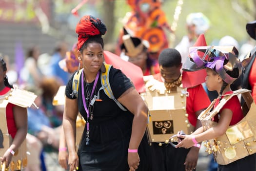 Cleveland, Ohio, USA - June 8, 2019: Parade the Circle, African American woman playing the drums during the parade