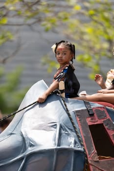 Cleveland, Ohio, USA - June 8, 2019: Parade the Circle, children riding an abstract rino during the parade