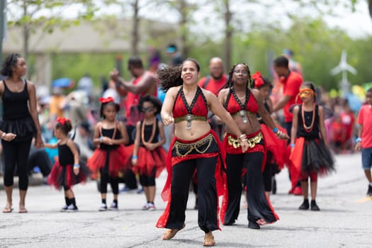 Cleveland, Ohio, USA - June 8, 2019: Parade the Circle, african american women and children dancing