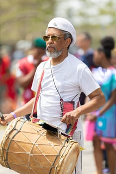 Cleveland, Ohio, USA - June 8, 2019: Parade the Circle, African American man playing the drums during the parade
