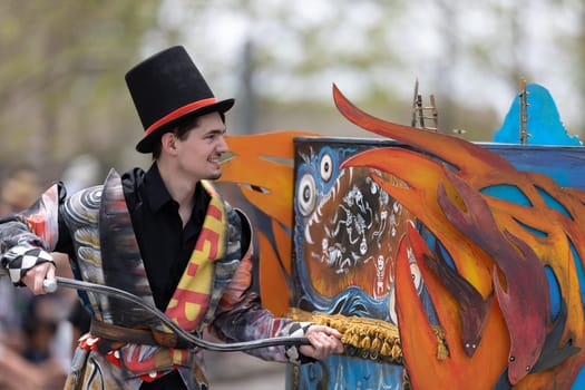 Cleveland, Ohio, USA - June 8, 2019: Parade the Circle, man dragging an abstract piece of art