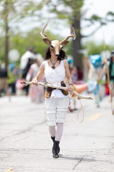 Cleveland, Ohio, USA - June 8, 2019: Parade the Circle, woman wearing a deer face mask