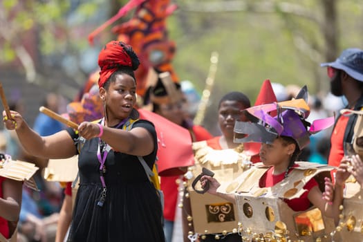 Cleveland, Ohio, USA - June 8, 2019: Parade the Circle, African American woman playing the drums during the parade