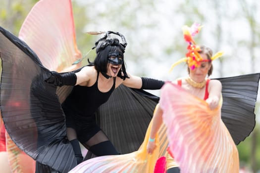 Cleveland, Ohio, USA - June 8, 2019: Parade the Circle, women on stilts with outfits with wings at the parade