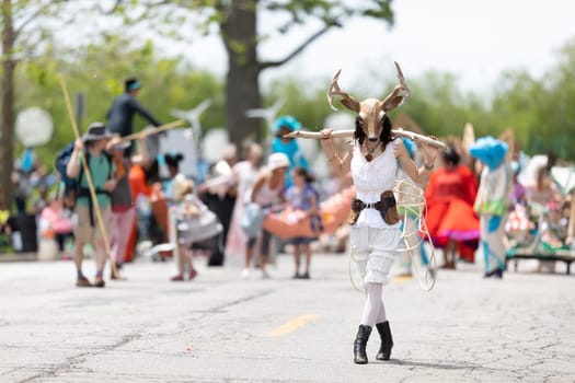 Cleveland, Ohio, USA - June 8, 2019: Parade the Circle, woman wearing a deer face mask