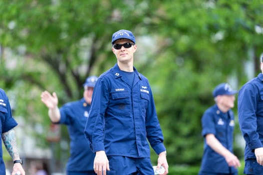 Louisville, Kentucky, USA - May 2, 2019: The Pegasus Parade, Members of the United States Coast Guard, marching down the street during the parade