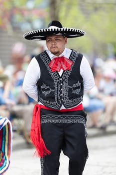 Cleveland, Ohio, USA - June 8, 2019: Parade the Circle, man wearing traditional mariachi clothing dancing