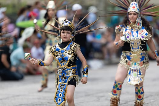 Cleveland, Ohio, USA - June 8, 2019: Parade the Circle, woman and children using aztek outfits dancing.