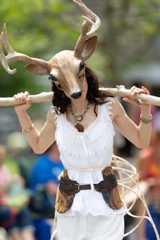 Cleveland, Ohio, USA - June 8, 2019: Parade the Circle, woman wearing a deer face mask