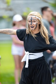 Cleveland, Ohio, USA - June 8, 2019: Parade the Circle, woman with face paint, dancing