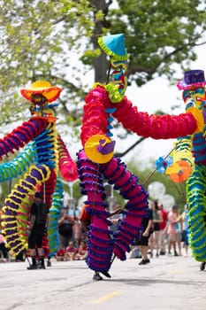 Cleveland, Ohio, USA - June 8, 2019: Parade the Circle, african american man carrying large puppets at the parade