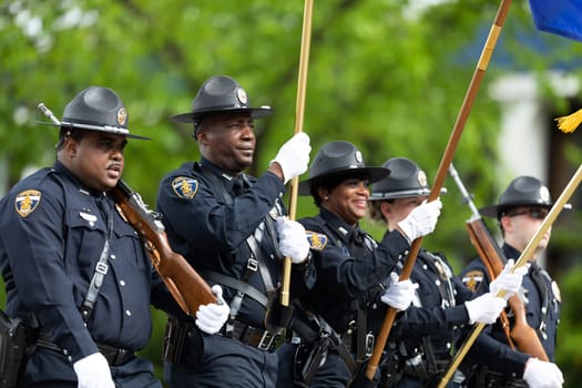 Louisville, Kentucky, USA - May 2, 2019: The Pegasus Parade, Members of the Louisville Police Honor Metro Guard escorting the American flag
