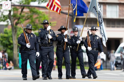 Louisville, Kentucky, USA - May 2, 2019: The Pegasus Parade, Members of the Louisville Police Honor Metro Guard escorting the American flag