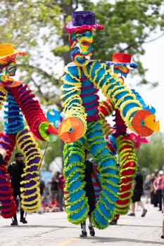 Cleveland, Ohio, USA - June 8, 2019: Parade the Circle, african american man carrying large puppets at the parade