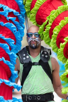 Cleveland, Ohio, USA - June 8, 2019: Parade the Circle, african american man carrying large puppets at the parade